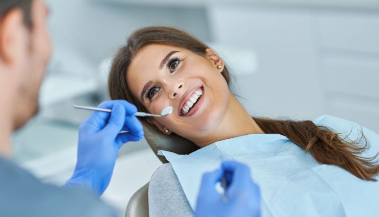 Woman smiling during a dental check-up.
